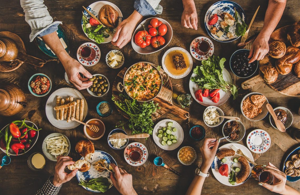 Flat-lay of Turkish family having traditional breakfast with various food