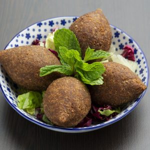 Kibbeh Middle Eastern dish of ground lamb with bulgar wheat and seasonings, eaten cooked or raw.